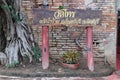 The roots of the trees that cover the old temple walls, Unseen, Thailand. Buddha image, nameplate Sai Ã¢â¬â¹Ã¢â¬â¹Temple at Wat Sai